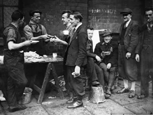 Unemployment Prints: A few of the 300 Scottish hunger marchers seen here having a meal before setting off