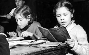 Dinner Prints: Over 37000 children in Londons L. C. C. scholos today sat down with pen