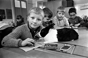 6-year-old John Sweeting (fair-haired boy with his pet rabbit in the classroom