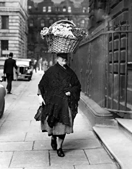 Basket Prints: This 68 year-old flower seller of Liverpool presents an unusual picture as she carries