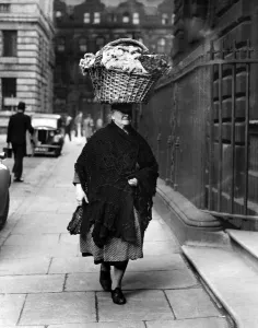 Basket Prints: This 68 year-old flower seller of Liverpool presents an unusual picture as she carries