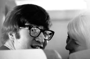 7 February 1964 John Lennon with wife Cynthia on the aircraft to New York