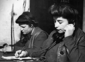 A. T. S. (The Auxiliary Territorial Service) telephonists in a Command Post receiving news