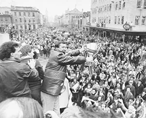 Aberdeen manager Alex Ferguson holding the European Cup Winners Cup trophy to crowded