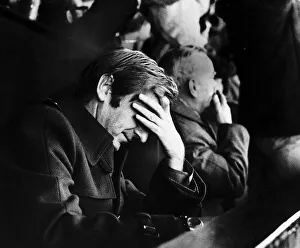 Aberdeen manager Ally MacLeod holds his head in his hand during a match against