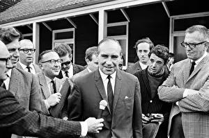 00248 Prints: ABeseiged by the media, Alf Ramsey forced a smile as he evaluated his side