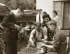00190 Prints: ABWW2 37 Canadian troops shucking (shelling) peas in an English garden