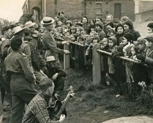 00190 Prints: ABWW2 41 Canadian troops dressed as cowboys entertain a group of evacuated children