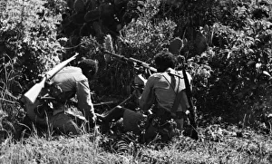 01023 Prints: Abyssinian War September 1935 Abyssinian machine gunner firing an old Hotchkiss