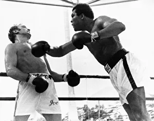 Action during the heavyweight world title fight between American Muhammad Ali