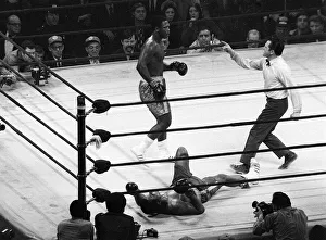 Action during the heavyweight World title fight between champion Joe Frazier