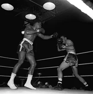 Action during the non-title heavyweight fight between American Cassius Clay