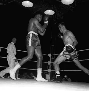 Action during the non-title heavyweight fight between American Cassius Clay