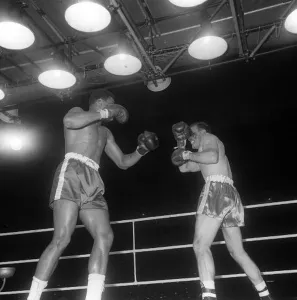 Action during the non-title heavyweight fight between American Cassius Clay