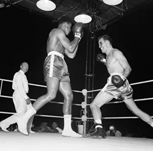 00398 Prints: Action during the non-title heavyweight fight between American Cassius Clay