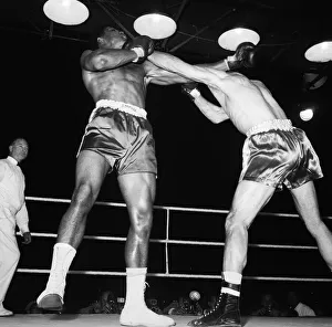 00398 Prints: Action during the non-title heavyweight fight between American Cassius Clay
