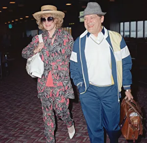 Actor David Jason and girlfriend Myfanwy Talog leaving Heathrow Airport for a holiday in