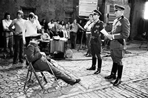 00658 Collection: Actor David McCallum (seated) on the film set during filming of Colditz
