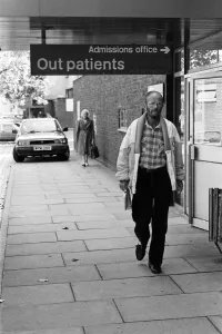 01047 Prints: Actor Douglas Lambert who has been diagnosed with AIDS leaving St Stephens Hospital
