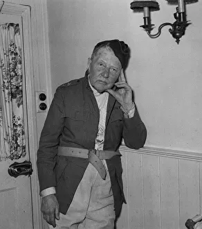 Despair Prints: Actor A E Matthews wearing army uniform leans his head onto his fingers