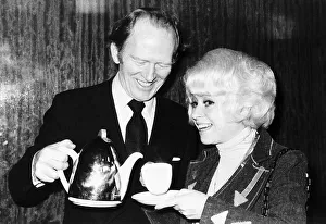 Occupation A Prints: Actor Gordon Jackson pours tea for Barbara Windsor 1976