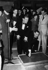 Cinemas Prints: Actor Will Hay has his feet set in concrete on arrival for a personnal appearence