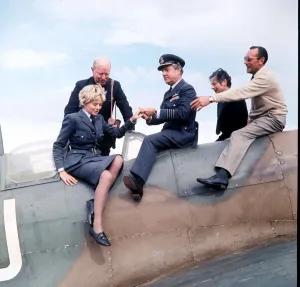 Actor Kenneth More and actress Susannah York seen here sitting on a Spitfire aircraft