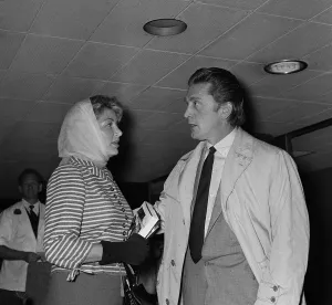 Actor Kirk Douglas at London Airport with his wife August 1958