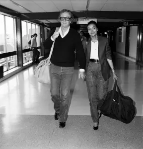 Luggage Prints: Actor Michael Caine and his wife Shakira arriving at Heathrow Airport from Barbados