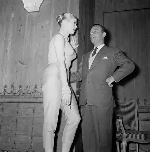 Tops Prints: Actor Norman Wisdom with actress Anita Ekberg at the Savoy Hotel in London