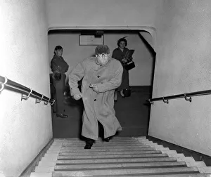 Actor Peter Sellers hurries upstairs of the Paris cinema in central London after his