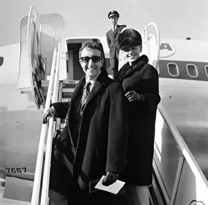 Actor Peter Sellers at London Airport with his wife Britt Ekland