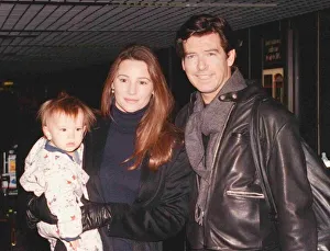 Actor Pierce Brosnan and girlfriend Keeley Shay Smith with baby Dylan Thomas arriving