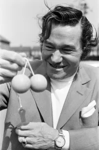 Actor, Reg Varney photo-call playing with new game Ker Knockers, at Wembley