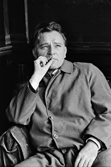 Actor Richard Burton, enjoying a moment of reflection in a London pub while shooting