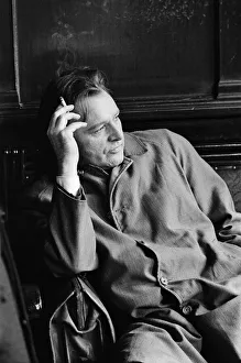 Actor Richard Burton, enjoying a moment of reflection in a London pub while shooting