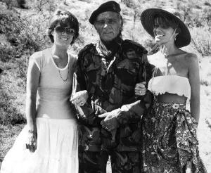 Camouflage Prints: Actor Richard Burton seen on location of Wild Geese with his wife