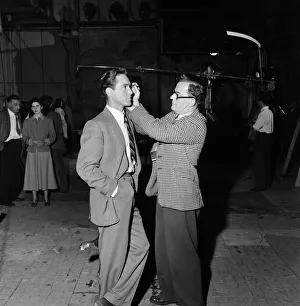 Actor Richard Todd being made up at Pinewood Studios. 1st June 1952