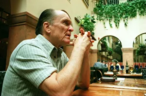 Hands Clasped Prints: Actor Robert Duvall in Glasgow May 1998 elbows on table hands clasped
