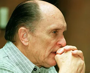 Actor Robert Duvall in Glasgow May 1998 hands clasped at face biting nail