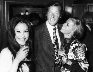 Actor Roger Moore with his Italian wife Louisa - July 1970 And Michael Caine