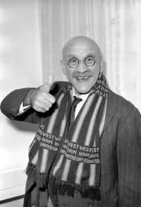 Actor Warren Mitchell in Australia tries to decide which team he favours for the FA Cup