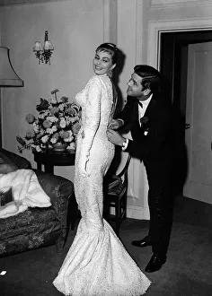 Core200 Prints: Actress Anita Ekberg has her dress zipped up by her husband Anthony Steel