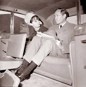 00140 Prints: Actress Audrey Hepburn with husband Mel Ferrer in the back seat of a car April 1964