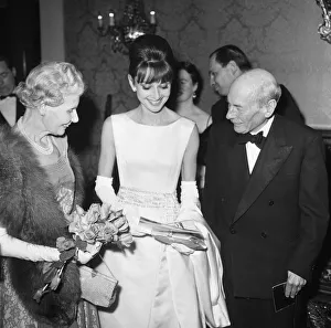 Actress Audrey Hepburn pictured with Earl and Countess Attlee at the London premiere of