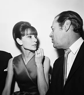 Actress Audrey Hepburn pictured with Rex Harrison at a press reception at the Savoy Hotel