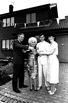 Pride Prints: Actress Barbara Windsor proposes a house-warming toast to DIY builders Allan