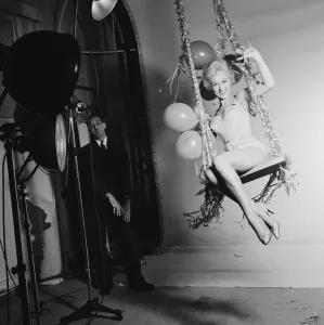 Swinging Prints: Actress Carole Leslie posing in the studio wearing a white dress