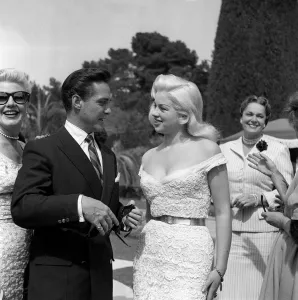 Bracelet Prints: Actress Diana Dors chatting with Richard Todd at the Cannes film Festival