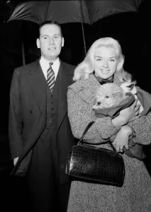 00168 Prints: Actress Diana Dors holding her pets as she arrives at court on assault charges